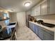 Bright kitchen with stainless steel appliances, grey cabinets, marble countertops, and stylish decor at 88 Barnes Rd, Middlesex, NC 27557