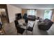 Spacious living room with tile floors, neutral walls, comfortable seating, and ample natural light at 88 Barnes Rd, Middlesex, NC 27557