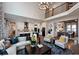 Open-concept living room flowing into a kitchen and dining area, hardwood floors, and lots of natural light at , Efland, NC 27243