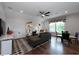 Upstairs living room featuring hardwood floors, a comfortable sofa, a mounted TV, and a window with natural light at , Efland, NC 27243