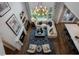 Aerial view of a modern living room with fireplace, hardwood floors, and a view of the kitchen at , Efland, NC 27243