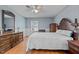Comfortable bedroom with wood floors, a traditional dresser, and classic furnishings at 102 Trinity Dr, Elon, NC 27244
