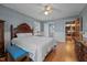 Bedroom with wood floors and traditional decor with views leading to the hallway and bathroom at 102 Trinity Dr, Elon, NC 27244