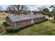 Charming brick home with green shutters and a well-manicured lawn, offering classic curb appeal at 102 Trinity Dr, Elon, NC 27244