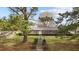 Charming single-story brick home with mature landscaping and a well-manicured front lawn at 102 Trinity Dr, Elon, NC 27244