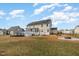 Two-story home featuring an above ground pool, screened porch, solar panels, large backyard, and fire pit at 104 Coats Ridge Dr, Benson, NC 27504