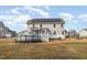 A two-story home featuring an above ground pool, a screened porch, a deck, and solar panels on the roof at 104 Coats Ridge Dr, Benson, NC 27504