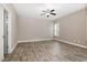 A simple bedroom provides a ceiling fan and neutral paint on the walls and flooring at 104 Coats Ridge Dr, Benson, NC 27504