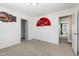 Open bedroom features neutral carpet and two open entryways with doors at 104 Coats Ridge Dr, Benson, NC 27504
