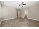 A spacious bonus room has vinyl flooring and a view into the bathroom at 104 Coats Ridge Dr, Benson, NC 27504