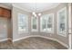 Bright dining area featuring three windows and a stylish chandelier, perfect for Gathering meals at 104 Coats Ridge Dr, Benson, NC 27504
