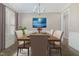Tastefully staged dining room with modern lighting and a sophisticated aesthetic at 104 Coats Ridge Dr, Benson, NC 27504