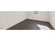 Hardwood flooring and a neutral color palette offers versatile design options in this bedroom at 106 Paper Birch Way, Fuquay Varina, NC 27526