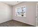 Hardwood flooring highlights a room with a large window that lets natural light stream in at 106 Paper Birch Way, Fuquay Varina, NC 27526