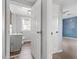 Bathroom featuring a grey vanity, a toilet, and an entrance to the bedroom at 107 N 12Th St, Erwin, NC 28339