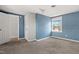 Neutral bedroom featuring carpet and a window for natural light at 107 N 12Th St, Erwin, NC 28339