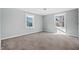 Bright bedroom featuring wall-to-wall carpeting and two windows at 107 N 12Th St, Erwin, NC 28339