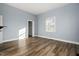 Bedroom with wood floors and a large window at 107 N 12Th St, Erwin, NC 28339