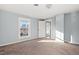 Spacious carpeted bedroom with natural light from two windows at 107 N 12Th St, Erwin, NC 28339