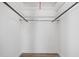 The closet has hardwood floors and white shelves on a hanging rack at 107 N 12Th St, Erwin, NC 28339