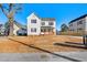 Charming two-story home with classic white siding and a welcoming front porch at 107 N 12Th St, Erwin, NC 28339