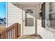 White front door with a window and a black mailbox at 107 N 12Th St, Erwin, NC 28339
