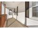 Covered front porch with white columns and a decorative light fixture at 107 N 12Th St, Erwin, NC 28339
