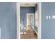 Hallway with blue walls and view of stairs at 107 N 12Th St, Erwin, NC 28339