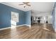 Spacious living room with hardwood floors and a view into the kitchen at 107 N 12Th St, Erwin, NC 28339