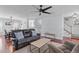 Open-concept living room boasts hardwood floors, natural light, and seamless connection to the dining area and staircase at 11 D'Ango Cir, Angier, NC 27501