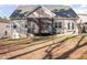 Back exterior of home featuring a porch and a large back yard perfect for outdoor activities at 113 Palladium Ct, Elon, NC 27244