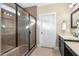 Bathroom featuring a large glass enclosed shower with tan tile and neutral flooring at 113 Palladium Ct, Elon, NC 27244