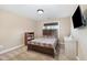 This charming bedroom is complete with neutral walls, carpeted floors and stylish wooden furniture at 113 Palladium Ct, Elon, NC 27244