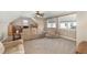 Spacious living area with a large, comfortable sofa, a chair and carpeted floors at 113 Palladium Ct, Elon, NC 27244