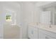 Bright bathroom featuring double sinks, a large mirror, and bright, natural light at 113 Paper Birch Way, Fuquay Varina, NC 27526