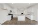 Open-concept kitchen with a large island, stainless steel appliances, and white cabinets at 113 Paper Birch Way, Fuquay Varina, NC 27526