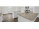 Modern kitchen featuring granite counters, stainless steel appliances, and a view to the backyard at 113 Paper Birch Way, Fuquay Varina, NC 27526