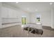 Spacious kitchen featuring granite countertops, a double sink, and ample cabinet space at 113 Paper Birch Way, Fuquay Varina, NC 27526