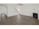 Bright living room with a fireplace, stairs, and an open floor plan at 113 Paper Birch Way, Fuquay Varina, NC 27526