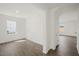 Sunlit living room boasts stylish flooring, neutral walls and ample space at 113 Paper Birch Way, Fuquay Varina, NC 27526