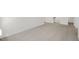 Spacious living room with neutral carpet and plenty of natural light at 113 Paper Birch Way, Fuquay Varina, NC 27526