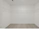 Walk-in closet featuring white wire shelving and neutral carpet at 113 Paper Birch Way, Fuquay Varina, NC 27526