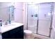 Modern bathroom features a stylish vanity, a white toilet, and a sleek glass-enclosed shower for a spa-like experience at 1136 Knotty Oaks Dr, Apex, NC 27523