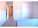 Neutral bedroom showing view of other rooms and featuring a bed, making it a welcoming private space at 1136 Knotty Oaks Dr, Apex, NC 27523