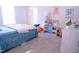 Bright bedroom features cute posters, colorful storage cubes, and cozy carpeting at 1136 Knotty Oaks Dr, Apex, NC 27523