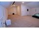 Spacious bonus room offers versatile possibilities and features carpet and neutral paint for a relaxing atmosphere at 1136 Knotty Oaks Dr, Apex, NC 27523