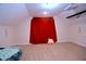 Attic bonus room featuring carpet, a projector screen, and neutral walls at 1136 Knotty Oaks Dr, Apex, NC 27523