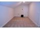 Unfurnished bonus room with carpet and good lighting; ready for customization at 1136 Knotty Oaks Dr, Apex, NC 27523