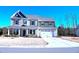 Charming two-story home with a two-car garage and well-maintained landscaping at 1136 Knotty Oaks Dr, Apex, NC 27523