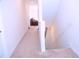 Carpeted hallway with view of the bonus room is well-lit and spacious at 1136 Knotty Oaks Dr, Apex, NC 27523